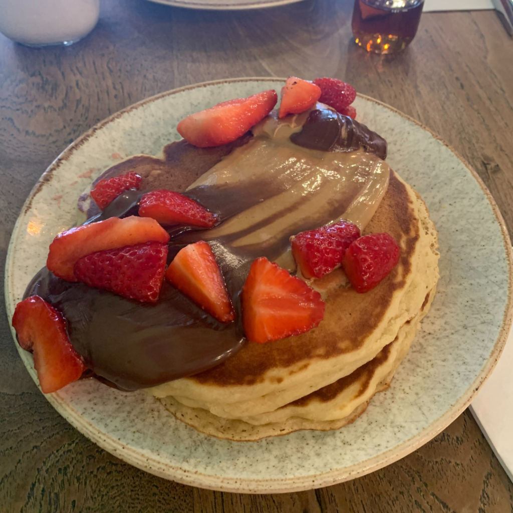 Pancake stack with strawberries on top